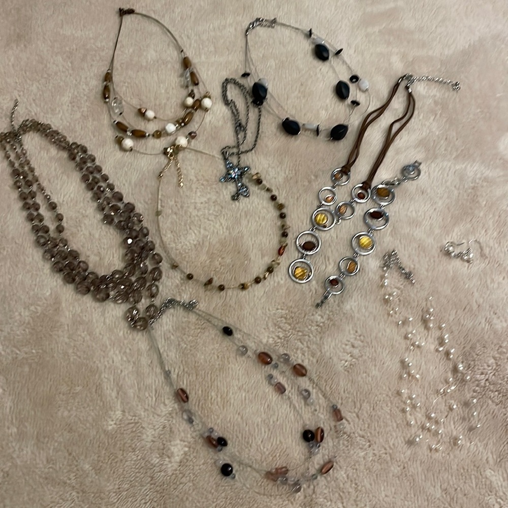 Variety of Lia Sophia necklaces. Earth tones, purple, black and grey